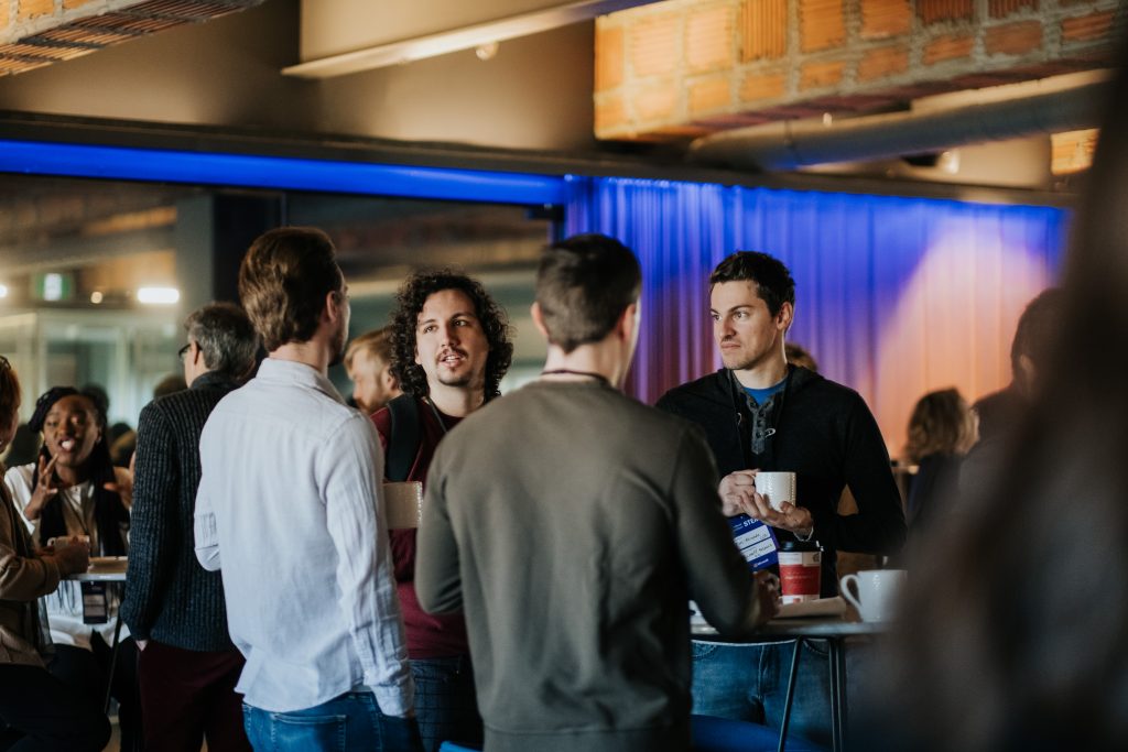 a group of people standing in a room