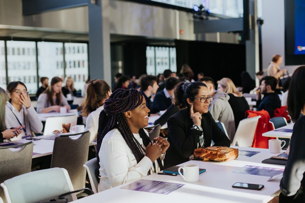 a group of people sitting at a table
