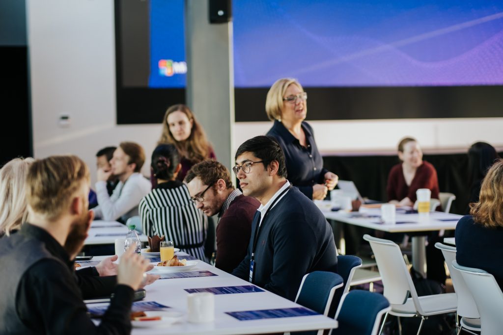 a group of people sitting at a table