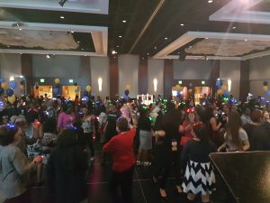 a group of people standing in front of a crowd