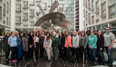 a group of people standing in front of a building
