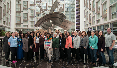 a group of people standing in front of a building