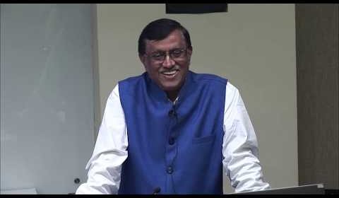 Dnyaneshwar Mulay wearing a suit and tie