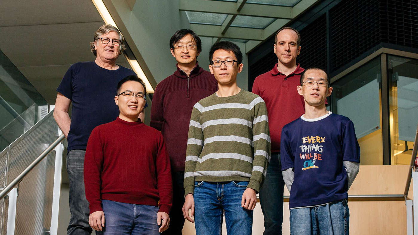 a group of people posing for a photo