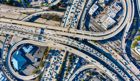 aerial view of crowded freeways and interchanges