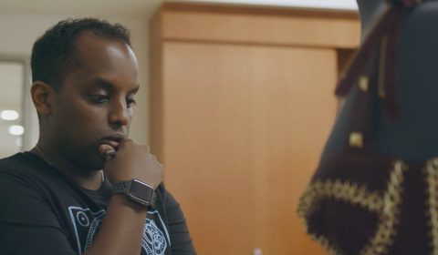 Research intern Teddy Seyed studies garment