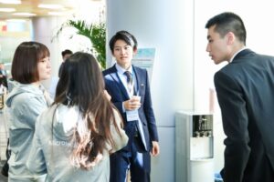a group of people standing in a room