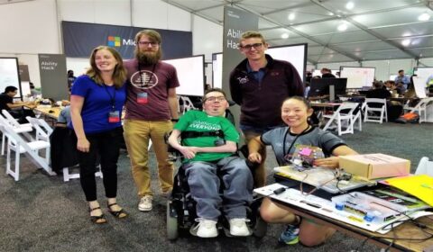 a group of people sitting at a desk