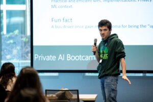 a man standing in front of a screen