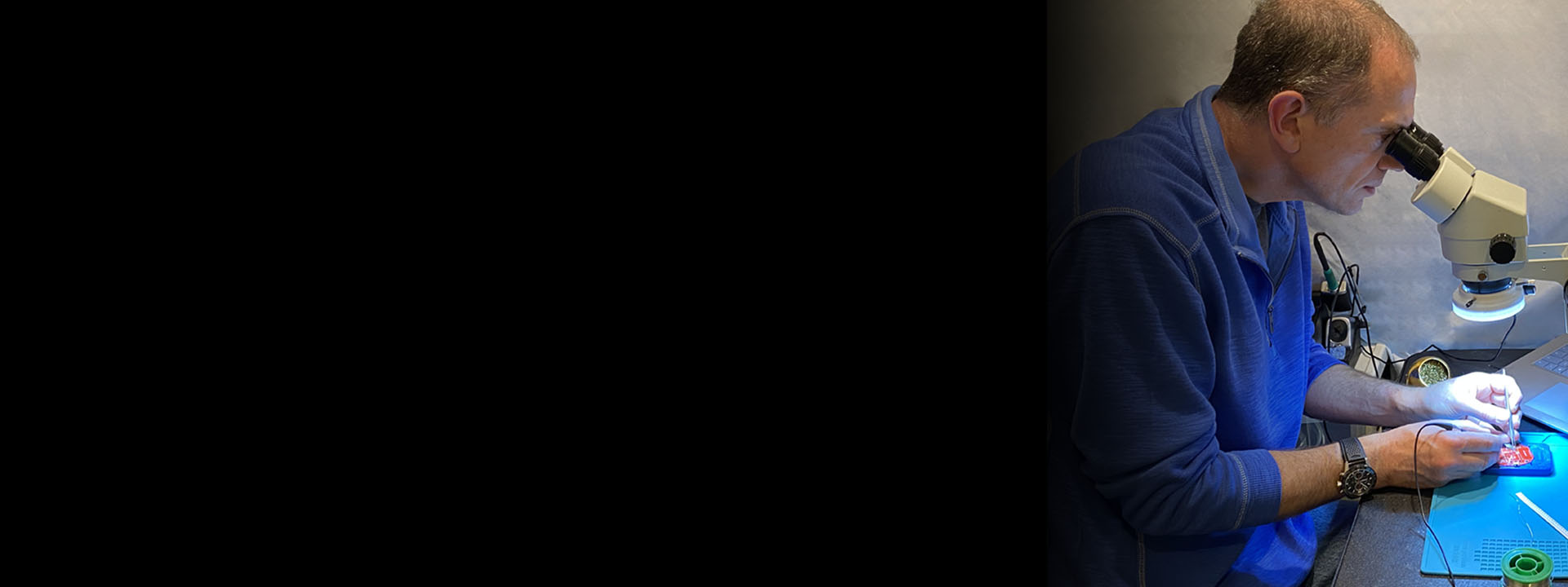 Microsoft Expressive Pixels project header: photo of man working on a LED device under a microscope