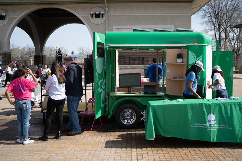 people visiting the EcoPod trailer at the Chicago Humboldt event