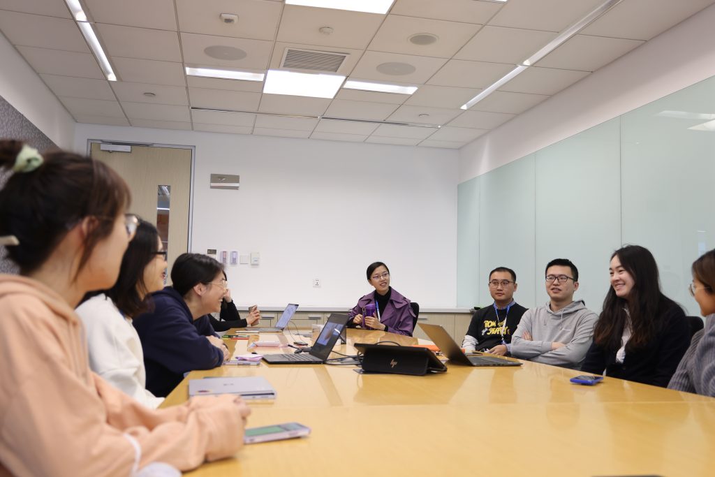 a group of people sitting at a table