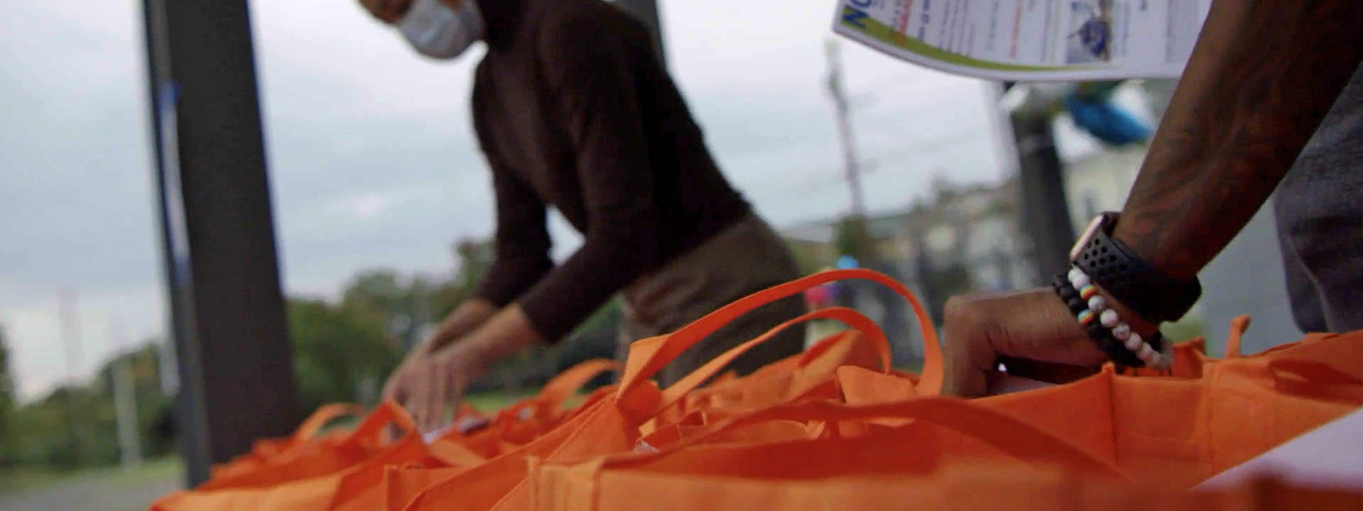 photo of two people filling bags at a community vaccine equity drive in North Carolina