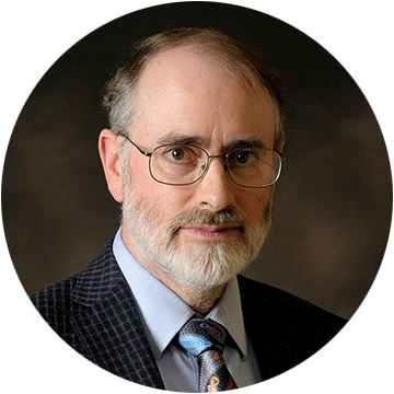 headshot of Tom Dietterich wearing a suit and tie