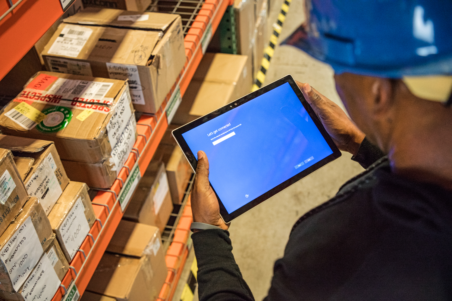 Warehouse worker with tablet
