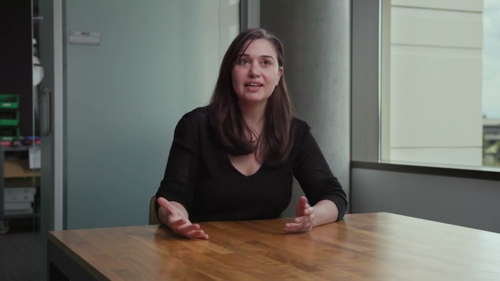 a woman sitting on a table