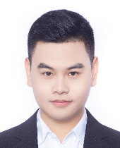 a young man wearing a suit and tie smiling at the camera