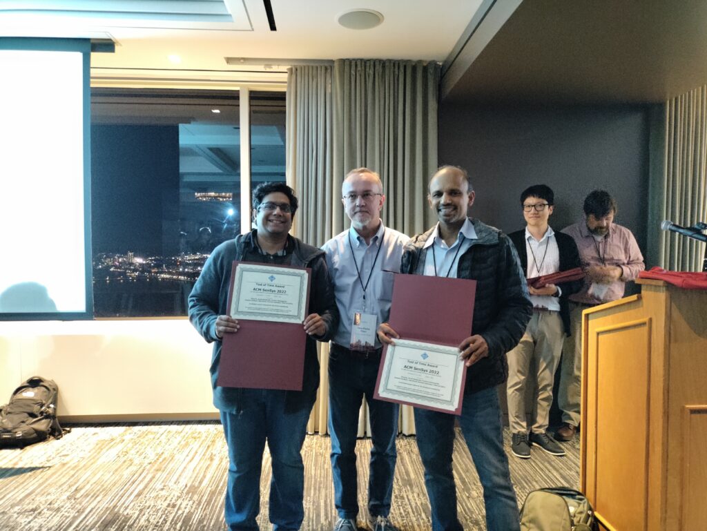 a group of people standing in front of a window