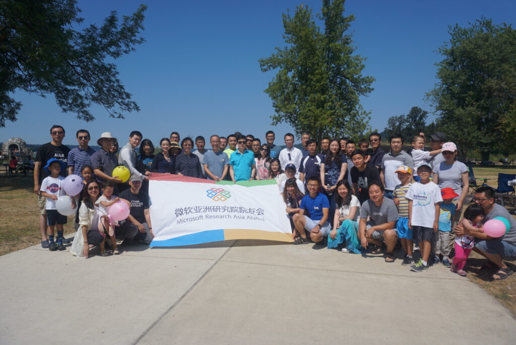 a group of people standing in front of a crowd