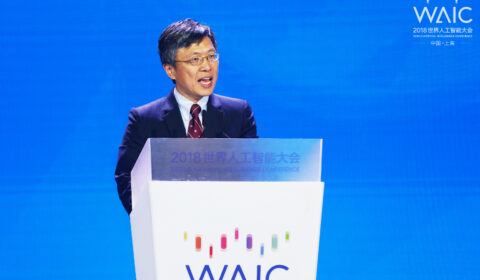 Harry Shum wearing a suit and tie