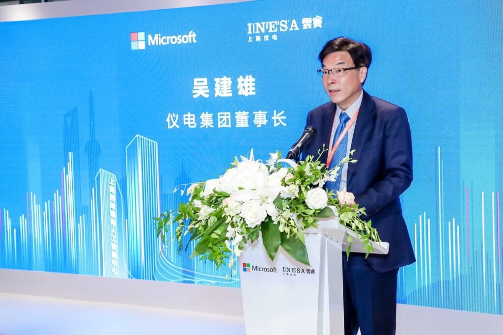 a man standing in front of a blue wall