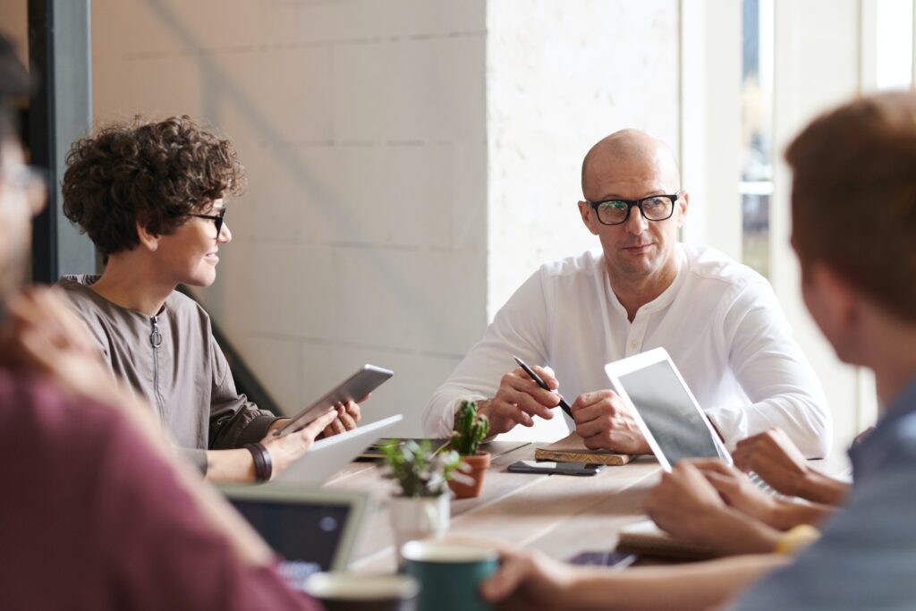 a group of people sitting at a table