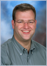 a man smiling for the camera