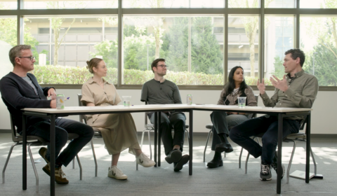 Jonathan M. Carlson, Will Guyman, Matthew Lungren, Cameron Runde, and Smitha Saligrama sitting around a table