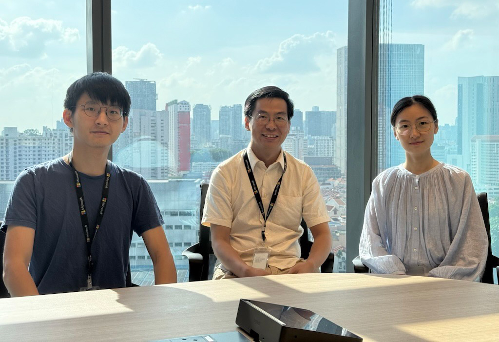 three persons posing for a camera