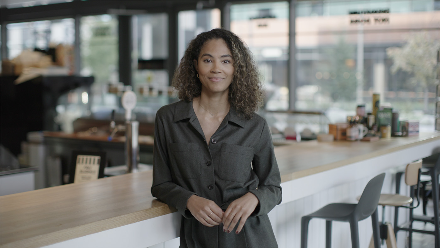 photo of Sinead Bovell leaning on a tall table