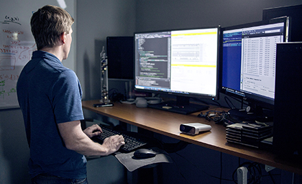 A man working at a PC workstation.