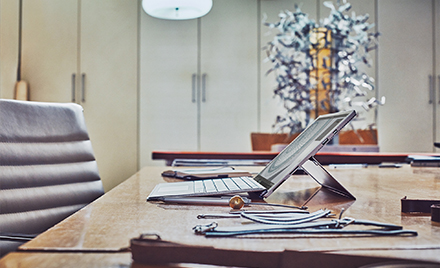 Image of a laptop open on a desk.