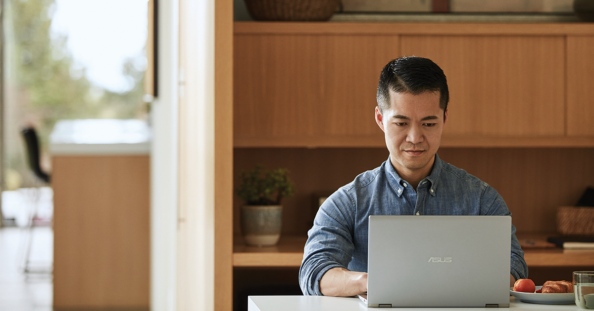 A man working on his PC.