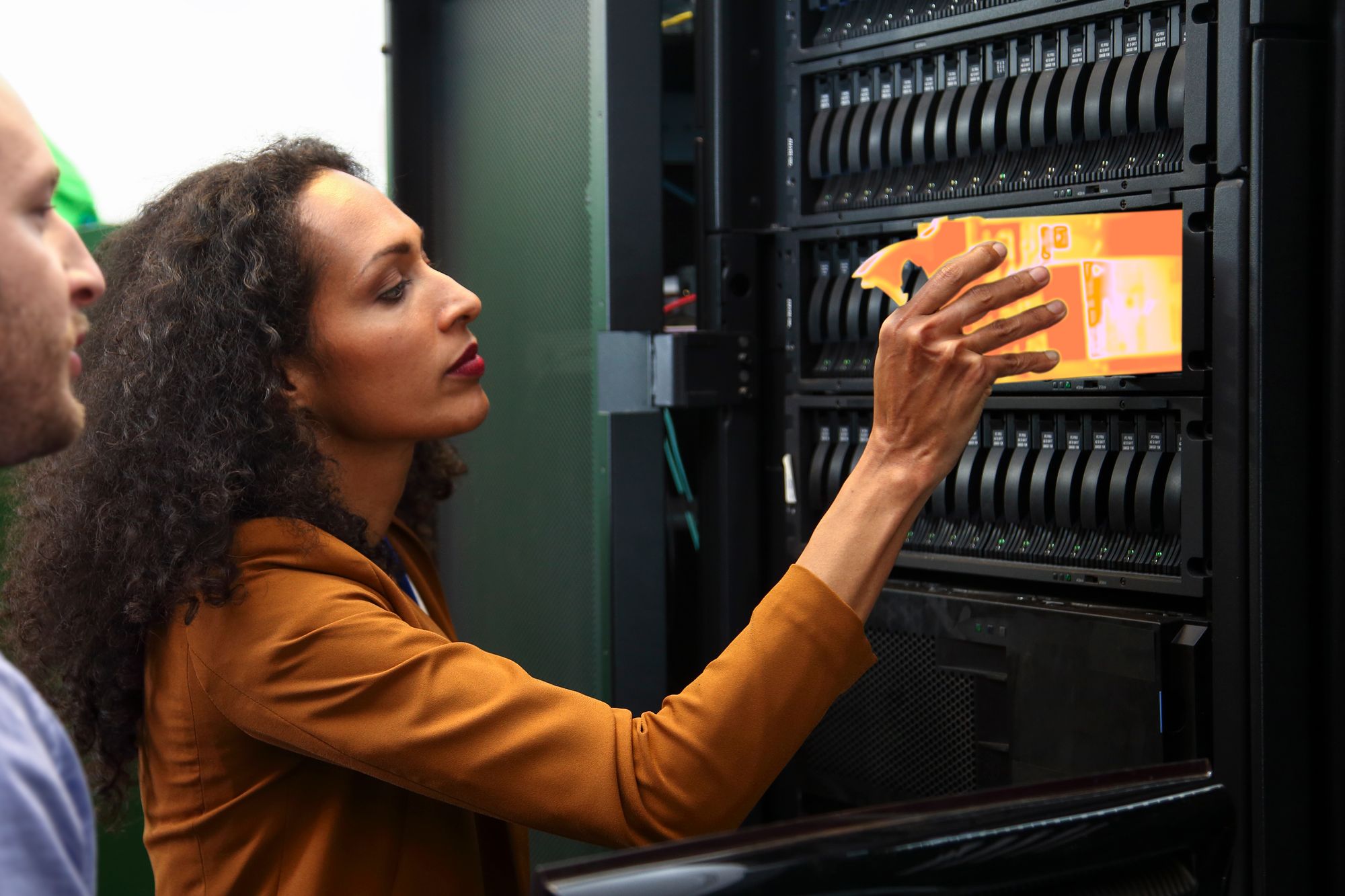 A woman touching a computer