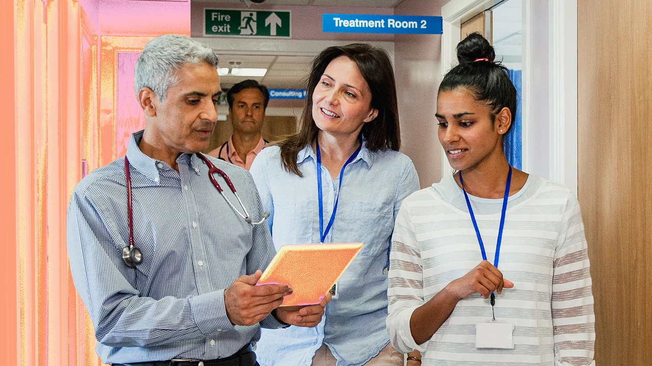 A group of people standing in a hospital