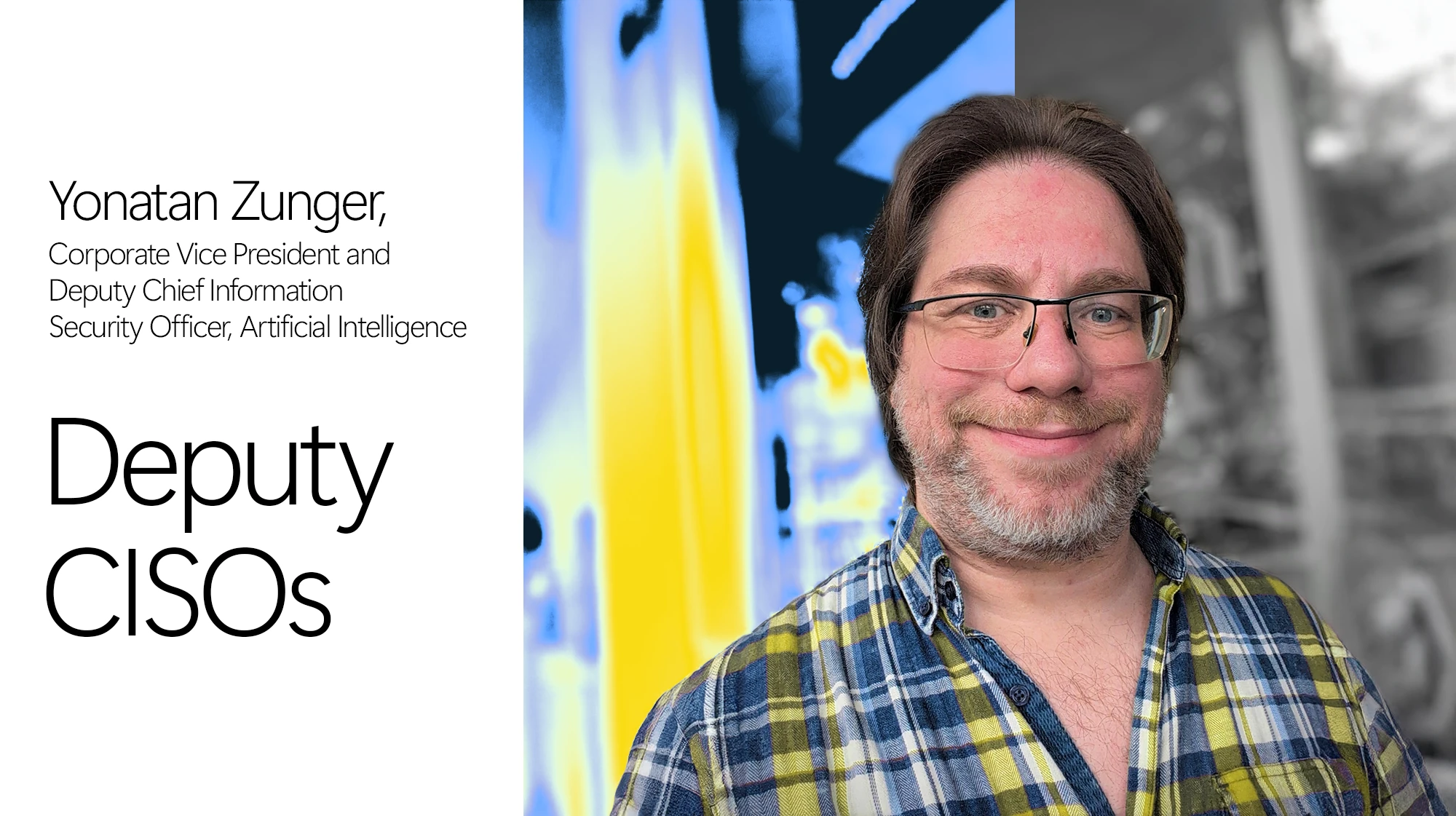 A man wearing glasses and a plaid shirt