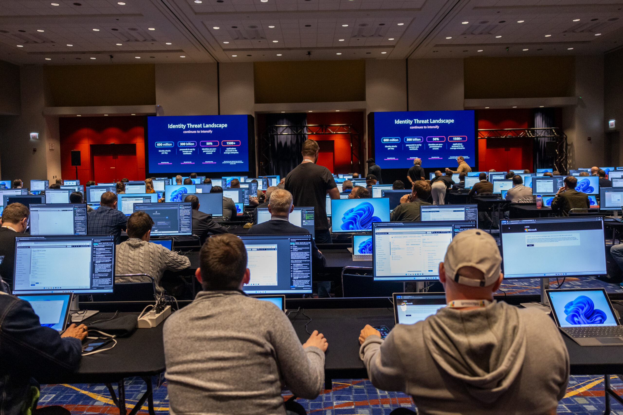 A group of people in a room with computers.