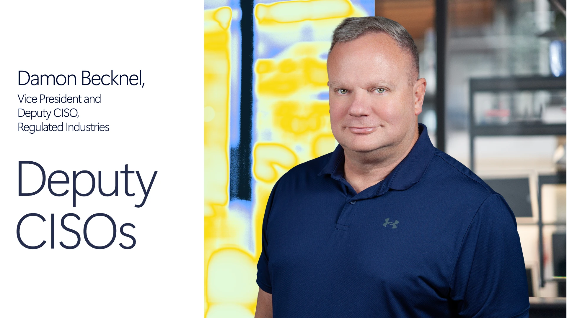 Man smiling in blue polo