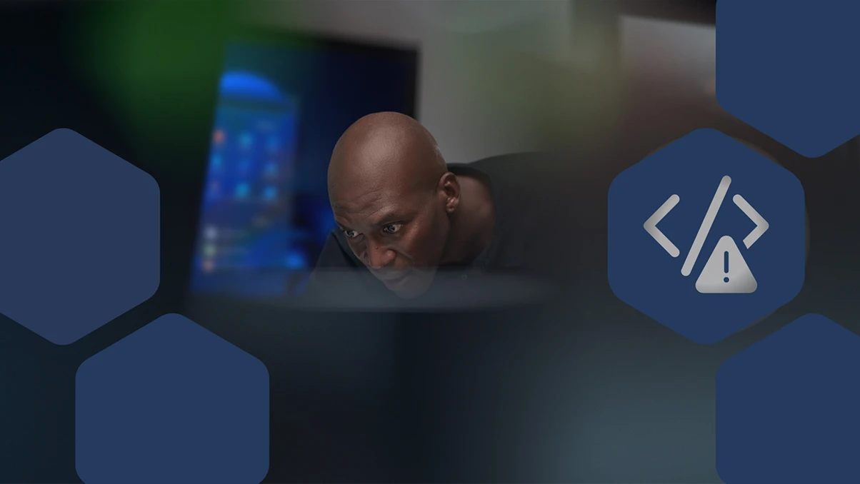 Close-up view of focused CISO (chief information security officer) at work in a security operations center.