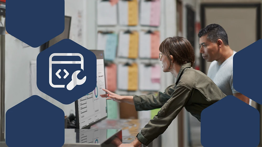 Photo of CEO and COO at a manufacturing company reviewing security reports.