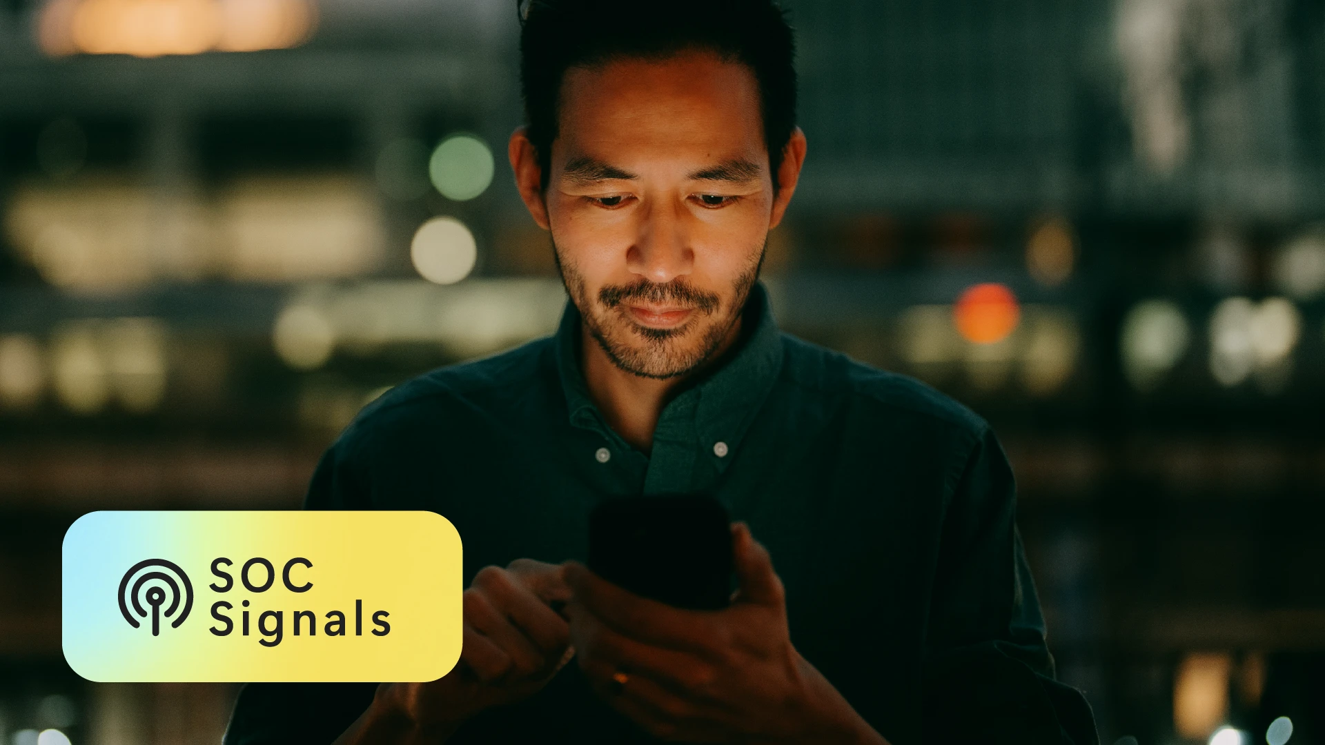 Man looking at cell phone SOC Signals