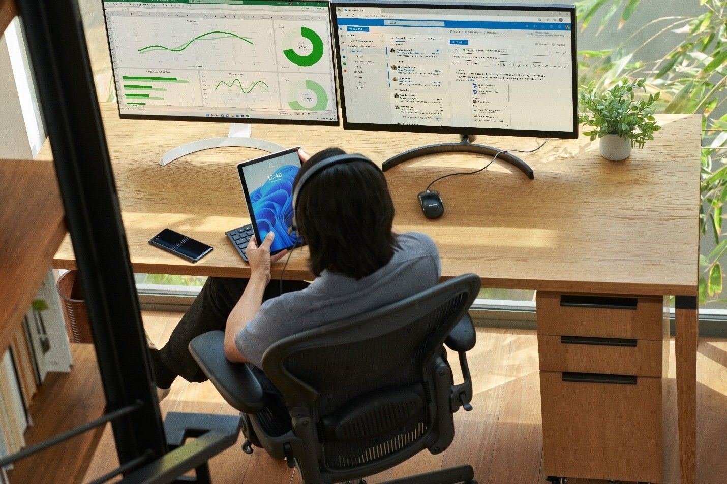 A security practitioner works at a computer