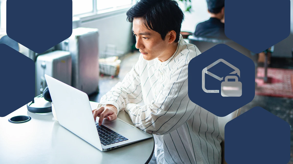 Man typing at laptop