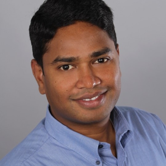 a man smiling for the camera