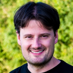 a man smiling for the camera