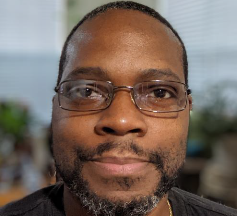 Image of the author, Derek Wilson, looking into the camera.