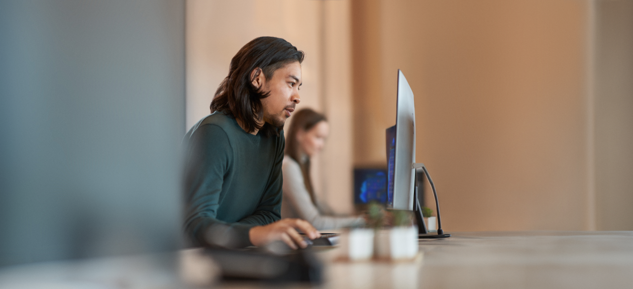Enterprise office worker in focused work with a positive facial expression.