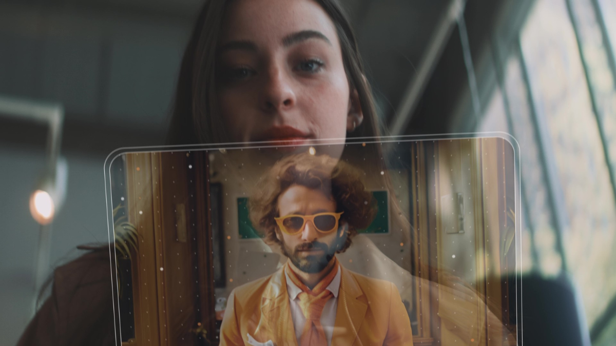 Image of women behind a transparent screen with a man in front.