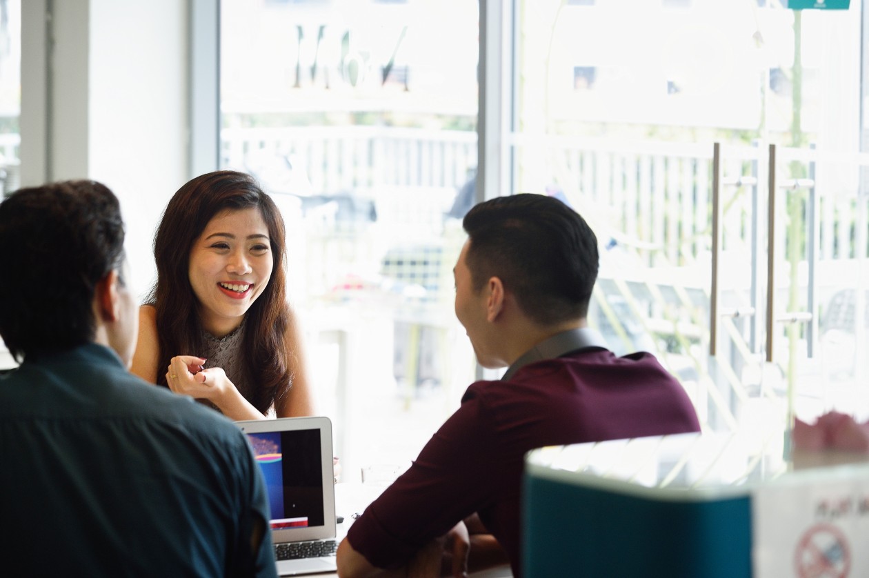 Young business executives sharing ideas.