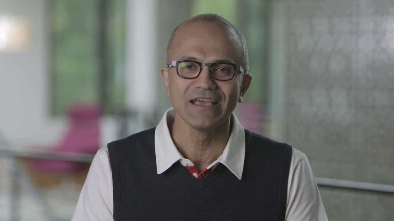 Satya Nadella wearing a suit and tie